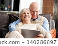 Senior couple browsing the internet together 140286697