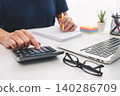 Man planning home budget and using calculator 140286709