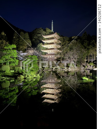 Five-storied tower reflected on the water surface Five-storied tower reflected on the water surface 140286712