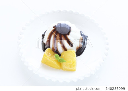 Almond tofu and mango with chocolate sauce Almond tofu and mango with chocolate sauce 140287099