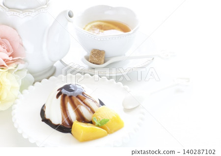 Almond tofu with chocolate sauce, mango, and lemon tea Almond tofu with chocolate sauce, mango, and lemon tea 140287102