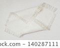 Fabric texture sample with woven threads and fringe edges placed on surface, textile sample, neutral modern tone, detailed weave pattern for design. Natural background, fabric texture 140287111
