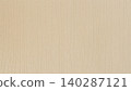 Beige paper texture fills frame with vertical fiber grain, copy space for packaging, stationery, craft, banner, product mockup. Natural background of beige paper, cardboard, wallpaper, material 140287121