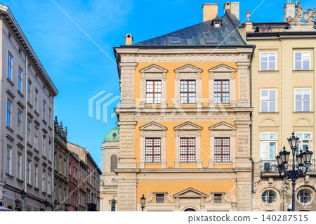 Charming European old town street with historic buildings and blue sky Charming European old town street with historic buildings and blue sky 140287515