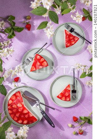 Strawberry cake slices with fresh berries and jasmine flowers Strawberry cake slices with fresh berries and jasmine flowers 140287821