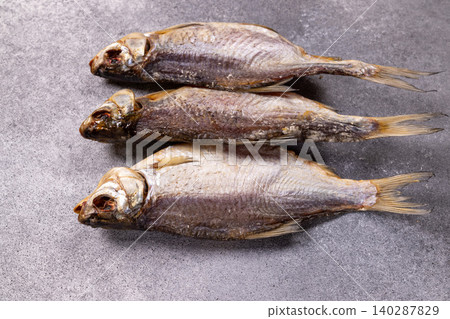Dried salted fish a traditional seafood snack Dried salted fish a traditional seafood snack 140287829
