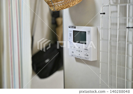 Installation of a remote control for an eco-friendly water heater (EcoCute) in the kitchen. Installation of a remote control for an eco-friendly water heater (EcoCute) in the kitchen. 140288048