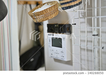 Installation of a remote control for an eco-friendly water heater (EcoCute) in the kitchen. Installation of a remote control for an eco-friendly water heater (EcoCute) in the kitchen. 140288050