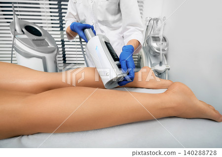 Endospheres therapy. Woman gets endospheres therapy and massage for legs. Anti-cellulite massage Endospheres therapy. Woman gets endospheres therapy and massage for legs. Anti-cellulite massage 140288728