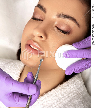 Facial cleansing. Beautiful woman having mechanical cleansing face skin from defect and remove blackhead, high quality Facial cleansing. Beautiful woman having mechanical cleansing face skin from defect and remove blackhead, high quality 140288782