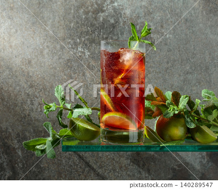 Cuba Libre with brown rum, cola, mint, and lime. Cuba Libre with brown rum, cola, mint, and lime. 140289547