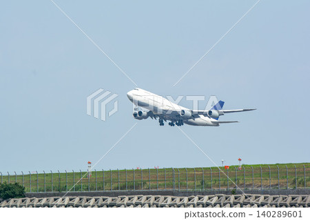 A jumbo jet taking off for an overseas destination 140289601