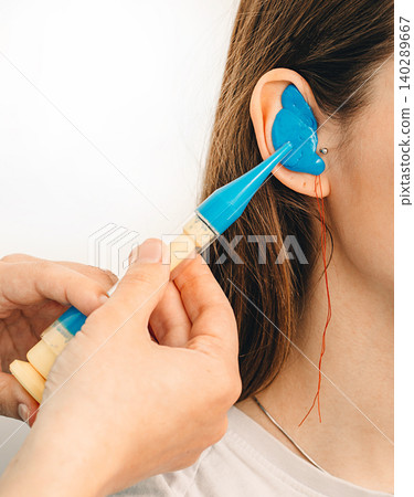Personally molded earplugs. Process of making earplug from an impression of an individual s woman ear. Audiology. Part of the set Personally molded earplugs. Process of making earplug from an impression of an individual s woman ear. Audiology. Part of the set 140289667