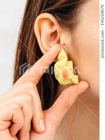 Personally molded earplugs. Process of making earplug from an impression of an individual s woman ear. Audiology. Part of the set Personally molded earplugs. Process of making earplug from an impression of an individual s woman ear. Audiology. Part of the set 140289670