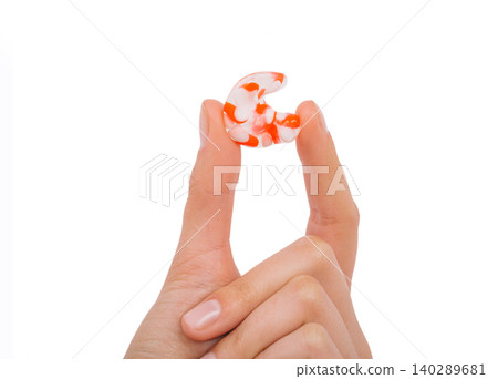 Isolated on white earplug in female hand. Personally molded earplugs close-up. Part of the set Isolated on white earplug in female hand. Personally molded earplugs close-up. Part of the set 140289681
