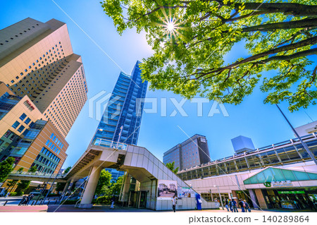 A new urban landscape of Yokohama, Japan. On a summer day, Sakuragicho Station, Washington Hotel, Fujisoft, and cranes are visible in the fresh greenery. A new urban landscape of Yokohama, Japan. On a summer day, Sakuragicho Station, Washington Hotel, Fujisoft, and cranes are visible in the fresh greenery. 140289864