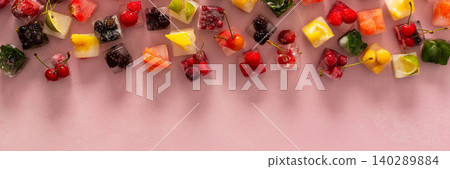 Pink background with ice cubes with frozen berries and fruits and mint, banner Pink background with ice cubes with frozen berries and fruits and mint, banner 140289884