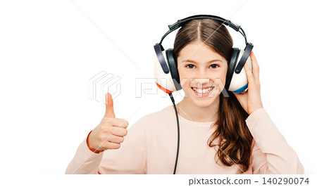 Hearing test. Positive girl in headphones during a hearing test, isolated on white. Audiometry Hearing test. Positive girl in headphones during a hearing test, isolated on white. Audiometry 140290074