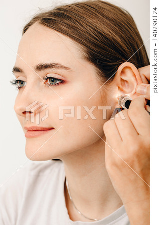 Personally molded earplugs. Process of making earplug from an impression of an individual s woman ear. Audiology. Part of the set 140290124