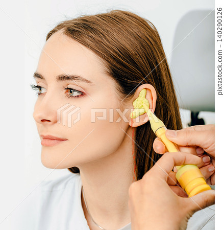 Personally molded earplugs. Process of making earplug from an impression of an individual s woman ear. Audiology. Part of the set Personally molded earplugs. Process of making earplug from an impression of an individual s woman ear. Audiology. Part of the set 140290126