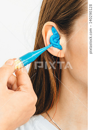 Personally molded earplugs. Process of making earplug from an impression of an individual s woman ear. Audiology. Part of the set 140290128