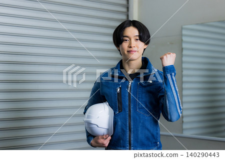 Young worker in denim work clothes Young worker in denim work clothes 140290443