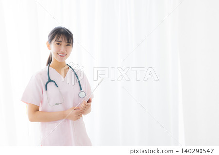 young female nurse in a white coat young female nurse in a white coat 140290547