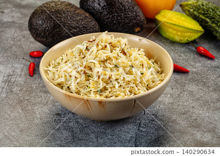 Bowl of Jeera Rice with Avocados and Starfruit on Gray Background Bowl of Jeera Rice with Avocados and Starfruit on Gray Background 140290634