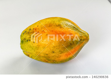 Whole ripe papaya fruit isolated on white background Whole ripe papaya fruit isolated on white background 140290636