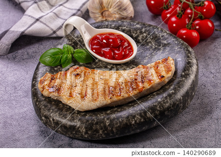 Grilled Chicken Breast with Ketchup and Basil 140290689