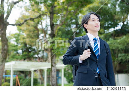 Businessman walking outdoors Businessman walking outdoors 140291153