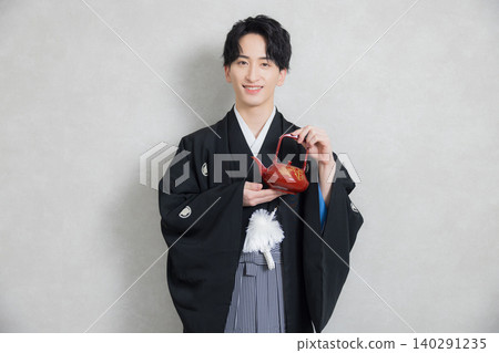 A young man in a hakama with family crest A young man in a hakama with family crest 140291235