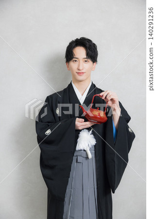 A young man in a hakama with family crest A young man in a hakama with family crest 140291236