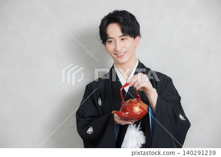 A young man in a hakama with family crest A young man in a hakama with family crest 140291239