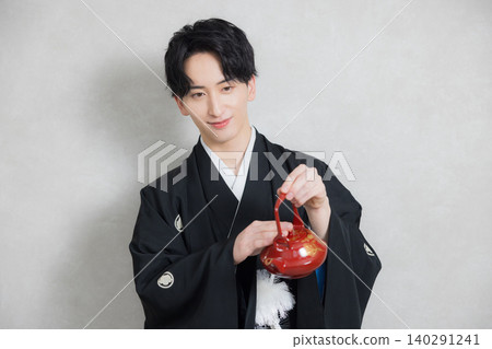 A young man in a hakama with family crest A young man in a hakama with family crest 140291241
