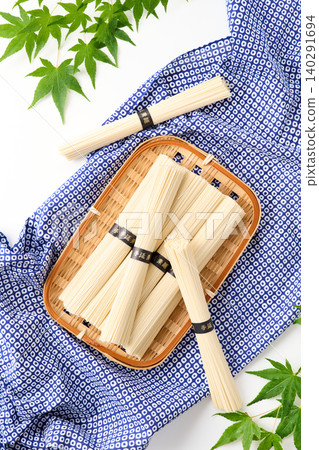 Hand-stretched somen noodles served on a bamboo sieve Hand-stretched somen noodles served on a bamboo sieve 140291694