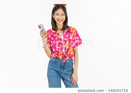 Portrait of young Asian woman in summer wearing floral shirt holding smartphone and smiling on white background. Portrait of young Asian woman in summer wearing floral shirt holding smartphone and smiling on white background. 140291728