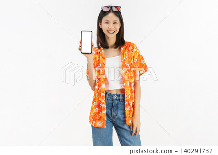 Portrait of young Asian woman in summer wearing floral shirt holding smartphone mockup of blank screen and smiling on white background Portrait of young Asian woman in summer wearing floral shirt holding smartphone mockup of blank screen and smiling on white background 140291732