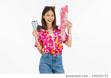 Young Asian woman in summer wearing floral shirt holding smartphone mockup of blank screen and credit card on white background. 140291735