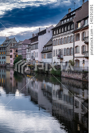 Dramatic Twilight Skyline Over Canal Timbered Buildings Dramatic Twilight Skyline Over Canal Timbered Buildings 140291891