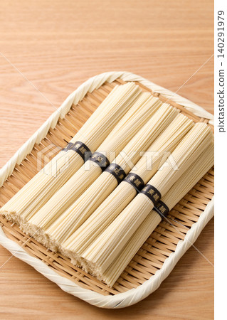 Hand-stretched somen noodles served on a bamboo sieve Hand-stretched somen noodles served on a bamboo sieve 140291979