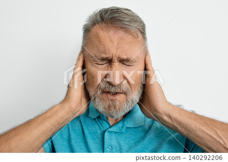 Migraine, headache, stress. Elderly man with headache touching hands on temples with suffering facial and eyes closed Migraine, headache, stress. Elderly man with headache touching hands on temples with suffering facial and eyes closed 140292206