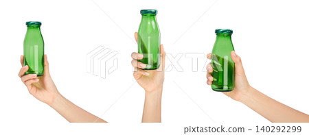 Clipping path, Hand holding green glass bottle on white background. Clipping path, Hand holding green glass bottle on white background. 140292299
