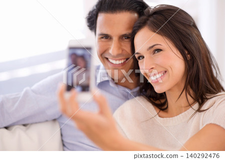 Happy couple, relax and selfie on sofa for bonding, photography or picture in living room together at home. Young man or woman with smile for photo vlog, picture or social media on couch at house 140292476