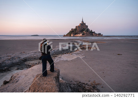 Girl Standing in Front of Mont-Saint-Michel, France 140292771