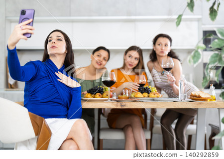Spanish woman takes selfie with friends Spanish woman takes selfie with friends 140292859