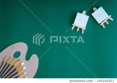 Colorful school supplies on a green background Colorful school supplies on a green background 140292921