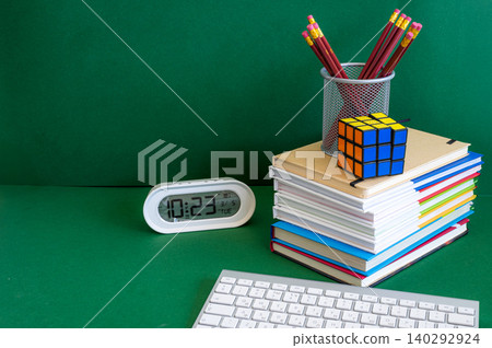 Colorful school supplies on a green background Colorful school supplies on a green background 140292924