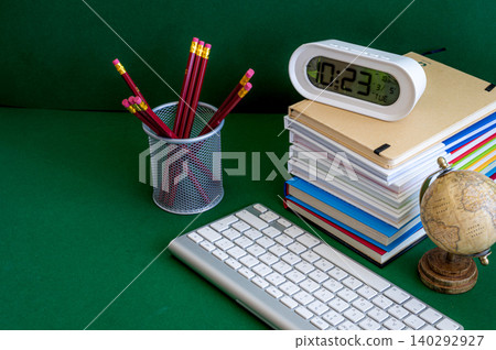 Colorful school supplies on a green background Colorful school supplies on a green background 140292927