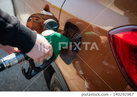 Refueling Car at Gas Station Fuel Pump Refueling Car at Gas Station Fuel Pump 140292967